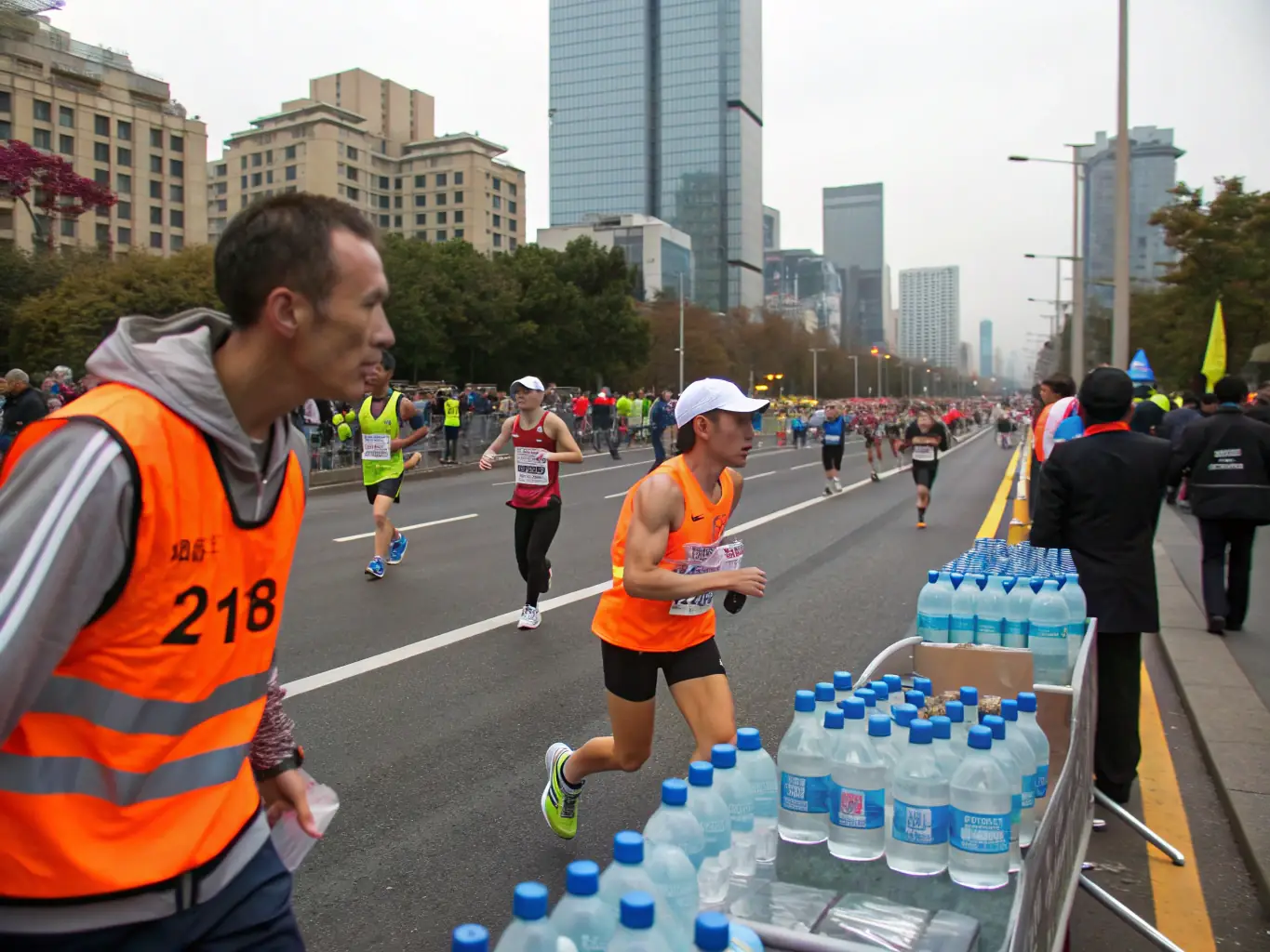 Volunteers assisting at a water station during a NUITS SEMI MARATHON ORGANISATION event, highlighting the community support and engagement.